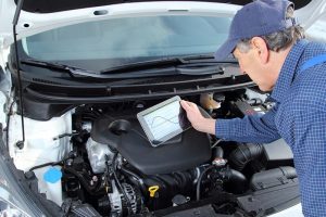 Picture of a mechanic working on engine diagnostics